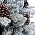 Snöig konstgjord julgran dekorerad med kottar 180 cm Faaborg Rea